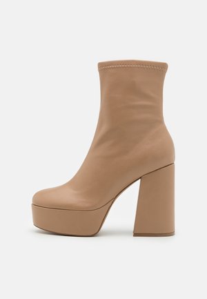 Klassiska stövletter - beige