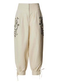 Pantalon large crème raccourci avec taille haute, motifs floraux noirs brodés sur les hanches, et liens ajustables aux poignets.