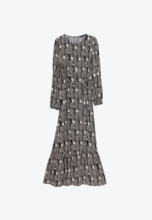Vestido de manga larga y largo hasta el suelo, con un patrón de olas en blanco y negro, cintura fruncida, falda fluida y sutil dobladillo con volantes.