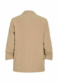 Blazer beige à manches longues avec manches froncées, couture droite au dos et col à revers, vu de dos sur un fond blanc.