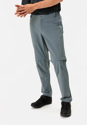 Lichte, grijze, afritsbare hikingbroek met een elastische tailleband en zijzakken, met een zachte textuur en taps toelopende pijpen.