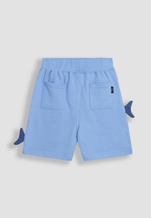 Vaaleansiniset puuvillahousut, joissa on kaksi takataskua, joustava vyötärö ja koristeelliset siniset hainevät yksityiskohdat sivuilla.