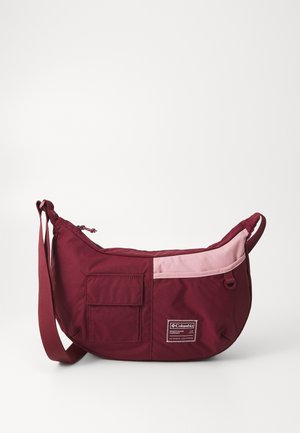 Maroon and pink shoulder bag with front flap pocket, zippered main compartment, and Columbia Sportswear Company logo patch.