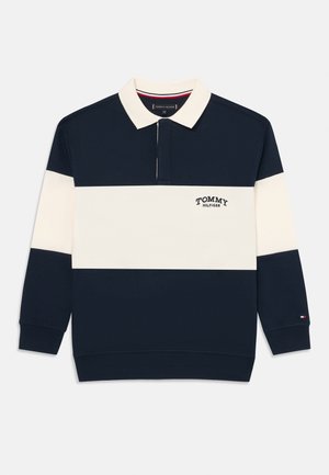 Jūras spēku un krēmkrāsas svītrainā polo džemperis ar apkakli, uz krūtīm ar "TOMMY HILFIGER" logo un nelielu karoga akcentu uz piedurknes.