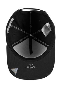 Black cap with a curved brim, interior lining in grey, and interior logos. Features a triangle label with "CAYLER & SONS" in white text.
