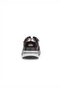 Black athletic shoe with a metallic accent on the heel, grey midsole, padded collar, and zip closures on the sides. Textured fabric design.