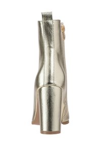 Metallic gold ankle boot with a squared high heel, smooth texture, rear zipper closure, and a pull tab at the back for easy wear.
