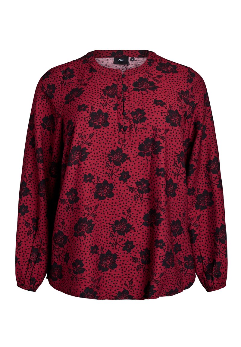 Blusa rossa a maniche lunghe con motivi floreali neri e pois, con scollatura a bottoni e vestibilità morbida.