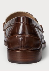 Brown leather loafers with a textured, croc-embossed design, featuring a rounded toe and a tan leather interior. Smooth, polished finish.
