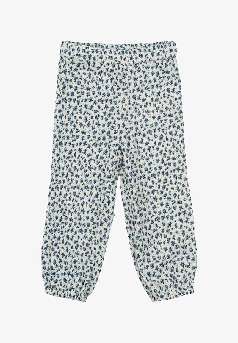 Bele hlače z modrim cvetličnim vzorcem, elastičnim pasom in nabrano manšeto na gležnjih. Lahkoten material in sproščen kroj.