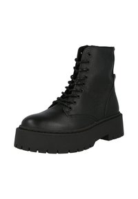 Bottines en cuir noir avec un bout arrondi, 6 œillets, semelle épaisse, dessus texturé et couture contrastante le long de la semelle.