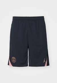 Mörk marinblå sportshorts i lätt material, med en rosa accent på sidan och logotyper för Paris och Jordan i guld.