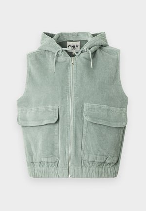 Veste sans manches à capuche en velours côtelé vert clair, dotée d'une fermeture éclair frontale, de deux grandes poches avant et d'un ourlet élastiqué.