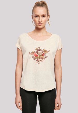 Helle beige Kurzarm-T-Shirt aus einem weichen Material. Mit einem bunten Cartoon-Grafik eines geflügelten Figures mit einem Heiligenschein. Rundhals. 