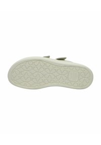 Weißer Gummisohlenschuh mit strukturiertem Muster, das hexagonale Formen zeigt. Leicht gepolsterte Innensohle für Komfort und Halt.