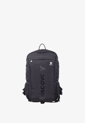 Black Discovery backpack with front zip pocket, mesh side pockets, top handle, and vertical branded logo on the front panel.