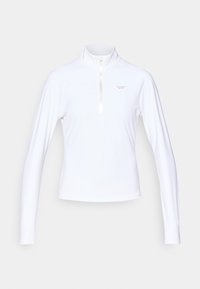 Balta ilgomis rankovėmis palaidinė su užtrauktuku ant kaklo, pagaminta iš lygaus audinio, su mažu logotipu kairėje krūtinės pusėje.