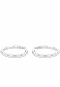 Pendientes de aro de plata con un acabado pulido. Forma circular, textura suave y cierre seguro. Diseño minimalista sin adornos adicionales.