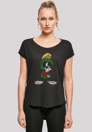 Black short-sleeve t-shirt featuring a cartoon character in green and red with white and red shoes, smooth texture, and a relaxed fit.