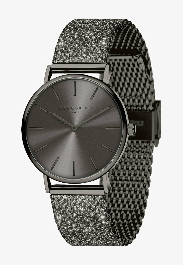 Orologio rotondo con cassa in metallo grigio scuro e quadrante grigio opaco. Presenta un cinturino in rete metallica testurizzata con accenti in argento e nero.