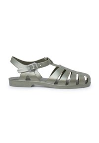 Green, lightweight jelly sandal with an open-toe design, multiple cutouts for ventilation, and an adjustable ankle strap.