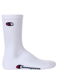White cotton crew sock with ribbed texture. Features a red and black logo on the side and black "Champion" text near the toe area.