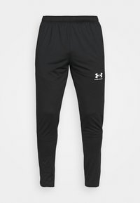 Svarta träningsbyxor av glatt, lättviktsmaterial med resår i midjan och avsmalnande ben. Har en vit Under Armour-logotyp på sidan.
