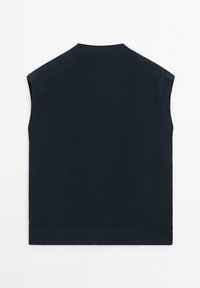 Mörk marinblå ribbad ärmlös topp med rund hals och rak nederkant. Har ett texturerat tyg med en subtil stretch.