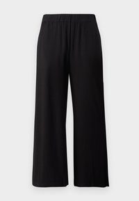 Schwarze, weit geschnittene Hosen aus weichem, dehnbarem Stoff. Mit einem elastischen Bund und einer glatten Textur, geeignet für die Freizeit.
