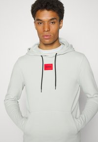 HUGO DARATSCHI - Sweatshirt com capuz - light pastel green