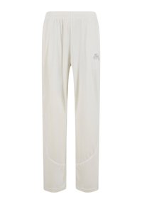 Pantalones de chándal beige claro hechos de tela suave, con una cinturilla elástica, detalles en los paneles laterales y un pequeño logotipo en el muslo.