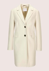 Crème-kleurige lange wollen jas met schouderklappen, twee voorflapzakken en twee zwarte knopen in het midden.