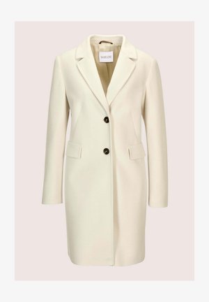 Cremefarbener, langer Wollmantel mit Reverskragen, zwei vorderen Pattentaschen und zwei schwarzen Knöpfen in der Mitte.