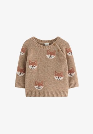 Pull en tricot beige avec des têtes de renard répétées en orange et blanc. Col rond, poignets et ourlet côtelés. Deux boutons en bois à l'épaule.