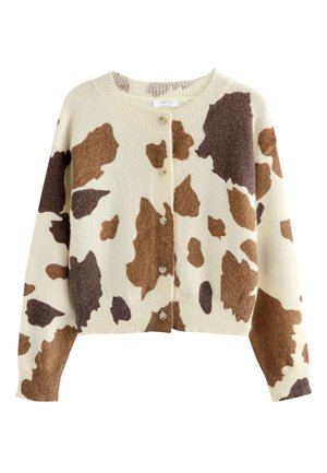 Crèmekleurige button-up cardigan met grote bruine en donkerbruine koeienprintpatronen en lange mouwen.