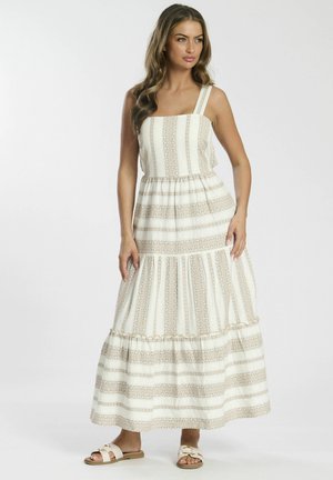 Maxi-jurk met een vierkante halslijn, dunne banden en een gelaagde zoom. Heeft een witte stof met beige strepen en kantaccenten. Gemaakt om te dragen met sandalen.