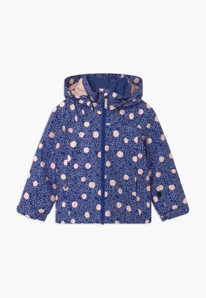 Veste imperméable bleu marine à pois roses et taches blanches, dotée d'une capuche, d'une fermeture éclair frontale et de poches latérales. Texture lisse.