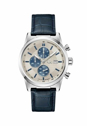 Chronograph watch with a silver stainless steel case, cream textured dial, three blue sub-dials, and dark blue crocodile leather strap.