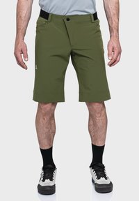 Grüne Shorts mit einem Reißverschlussfach und einem Knopfverschluss. Aus leichtem Material gefertigt, mit geradem Schnitt und einem dezenten Logodetail.