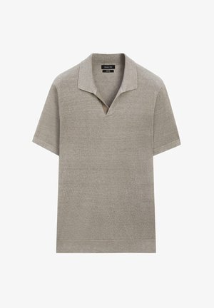 Beige polo-shirt met korte mouwen, gebreid, met een open kraag en geribde zoom, gemaakt van zachte stof.