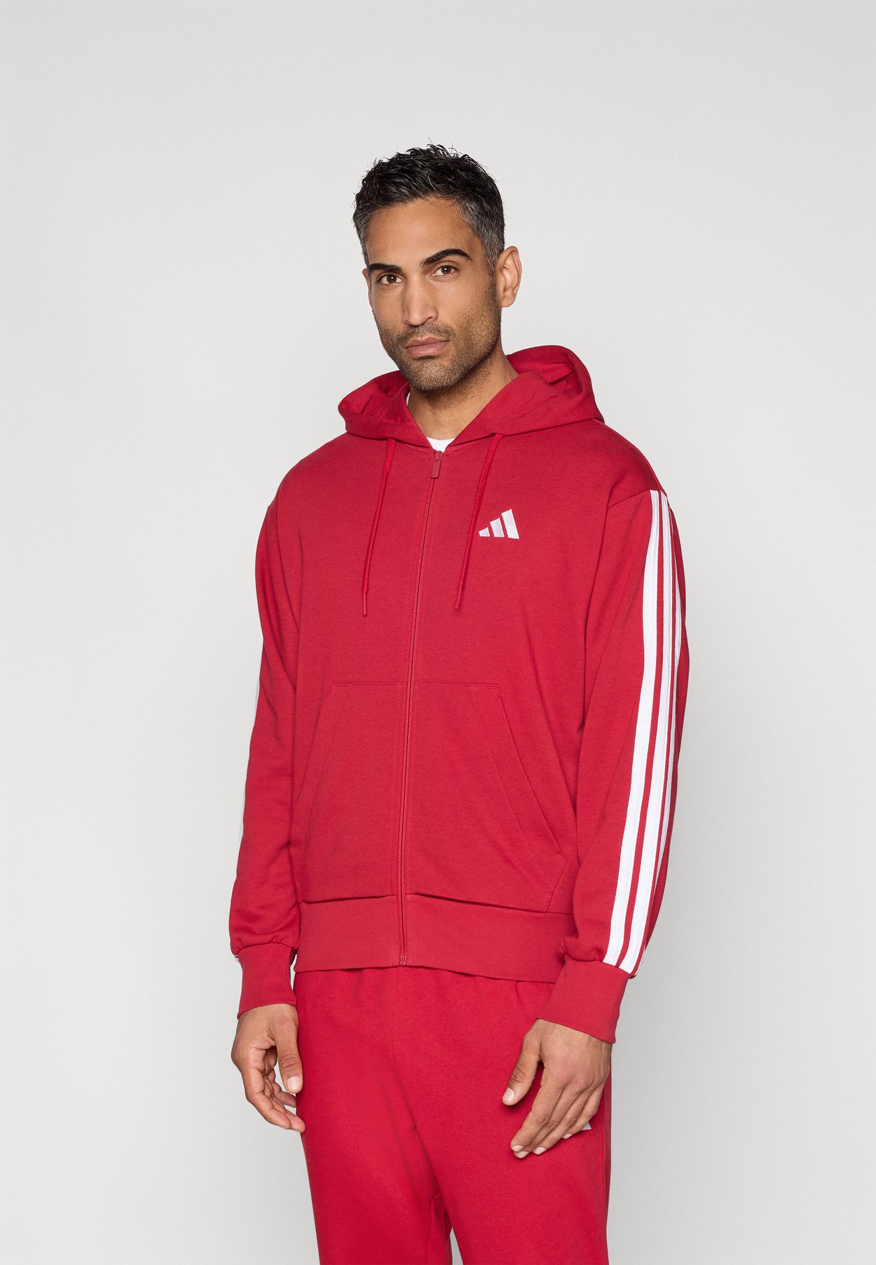 ESSENTIALS THREE STRIPES FRENCH TERRY FULLZIP