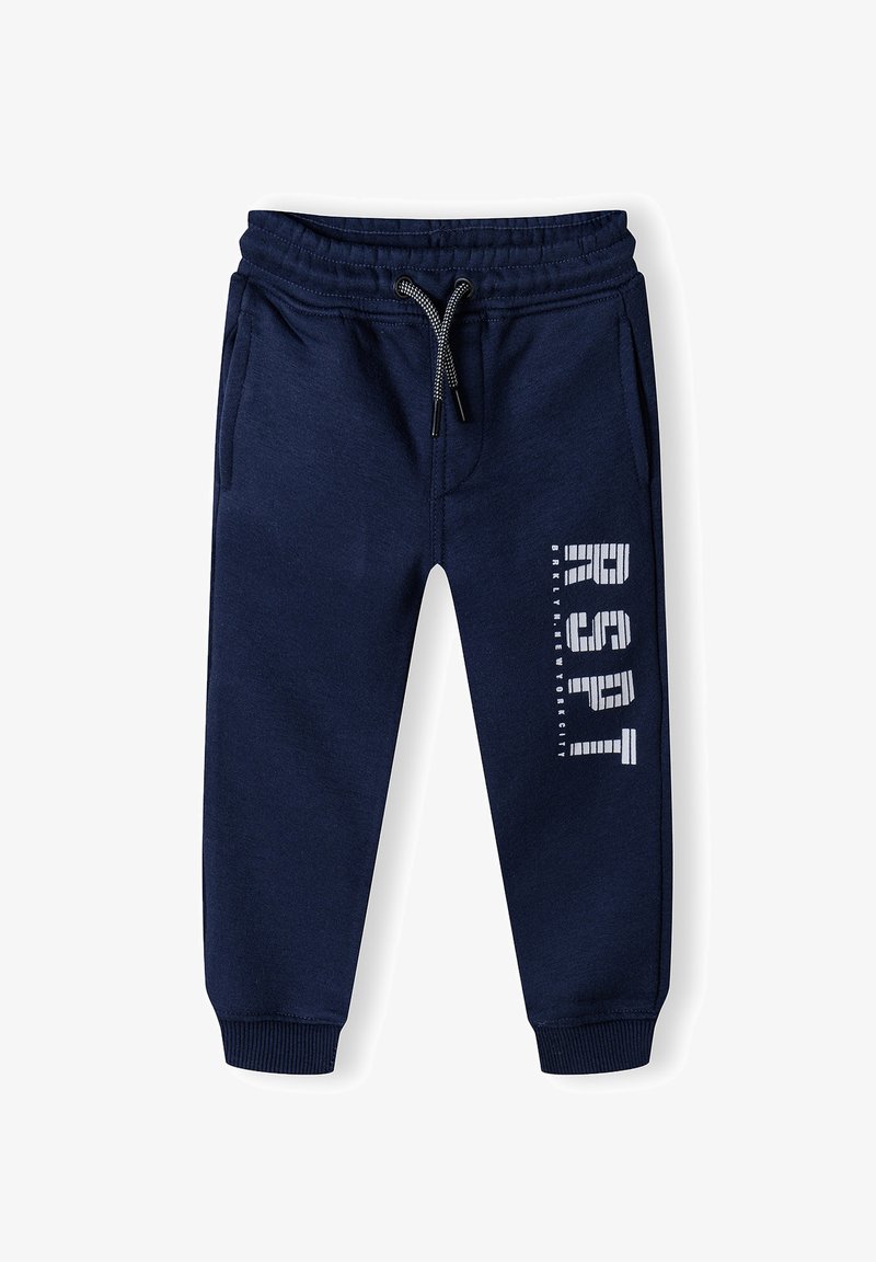 Tumši zili sporta bikses ar elastīgu jostu un auklu, ribotām potīšu malām, sānu kabatām un baltiem uzrakstiem "RSQT" uz vienas kājas.