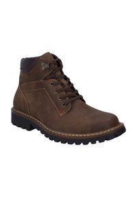Bruine leren enkelboots met een contrasterende donkerbruine kraag, ronde neus en vetersluiting; voorzien van rode stiksels en een robuuste zwarte outsole.