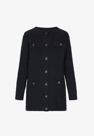 Tumedat õhukesed kudumid, millel on nööbid ees, ümmargune kaelus ja kaks rinna taskut metallaktsentidega.