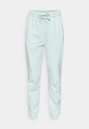 Pantaloni sport verde mentă deschis cu talie elastică, detaliu cu șnur, buzunare laterale și picioare conice. Confecționați dintr-un material moale și neted.