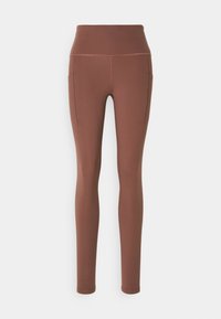 Högmidjade slim fit bruna leggings med sidofickor, slät textur och synliga sömmar på benen och midjebandet.