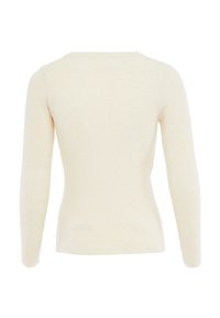 Top a maniche lunghe color crema in maglia a coste, con scollatura rotonda, design aderente e superficie liscia, privo di loghi o decorazioni visibili.