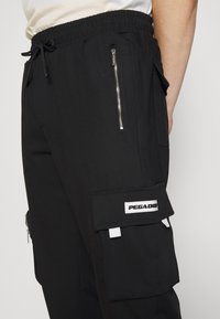 Pegador Cargobyxor - black