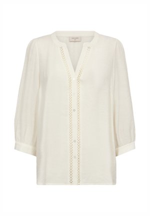 Biała bluzka z długim rękawem, okrągłym dekoltem, zapinana na guziki z przodu, z ozdobną ażurową lamówką wzdłuż listwy guzikowej.