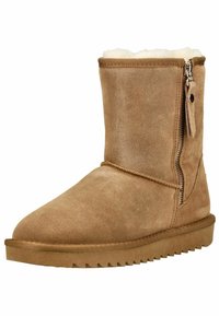 Stivale alla caviglia in suede marrone con chiusura a zip, finitura testurizzata, fodera morbida e suola piatta in gomma con motivo a zigzag.